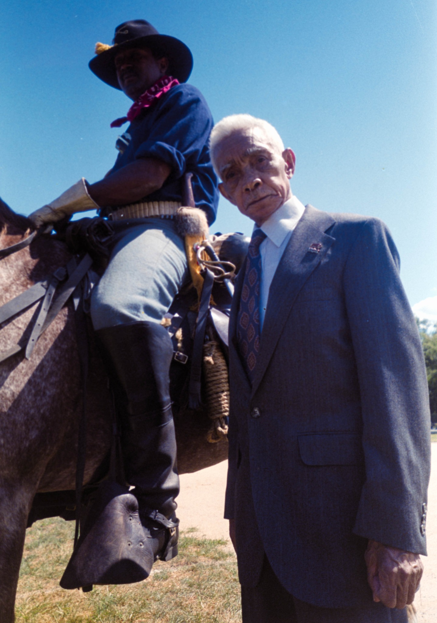 William Robert Wardlaw Sr. beside a mounted Buffalo Soldier re-enactor in 1995